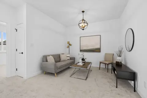The upstairs bonus room. Furniture and décor are staging for the photos.