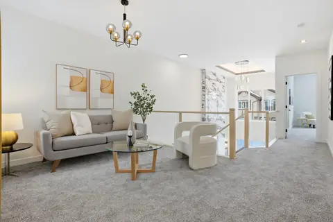 The upstairs bonus room. Furniture and décor are staging for the photos.