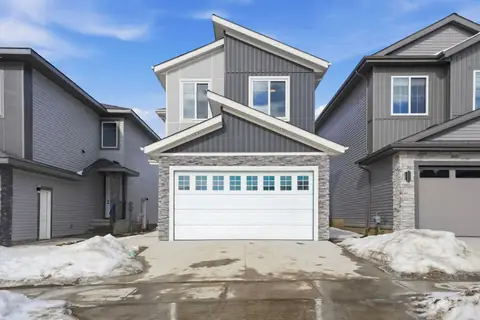 The front of a second finished Vita home in Triomphe Estates (winter 2026).